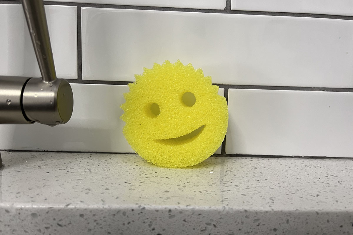 granite countertop and white tiles with scrub daddy sponge